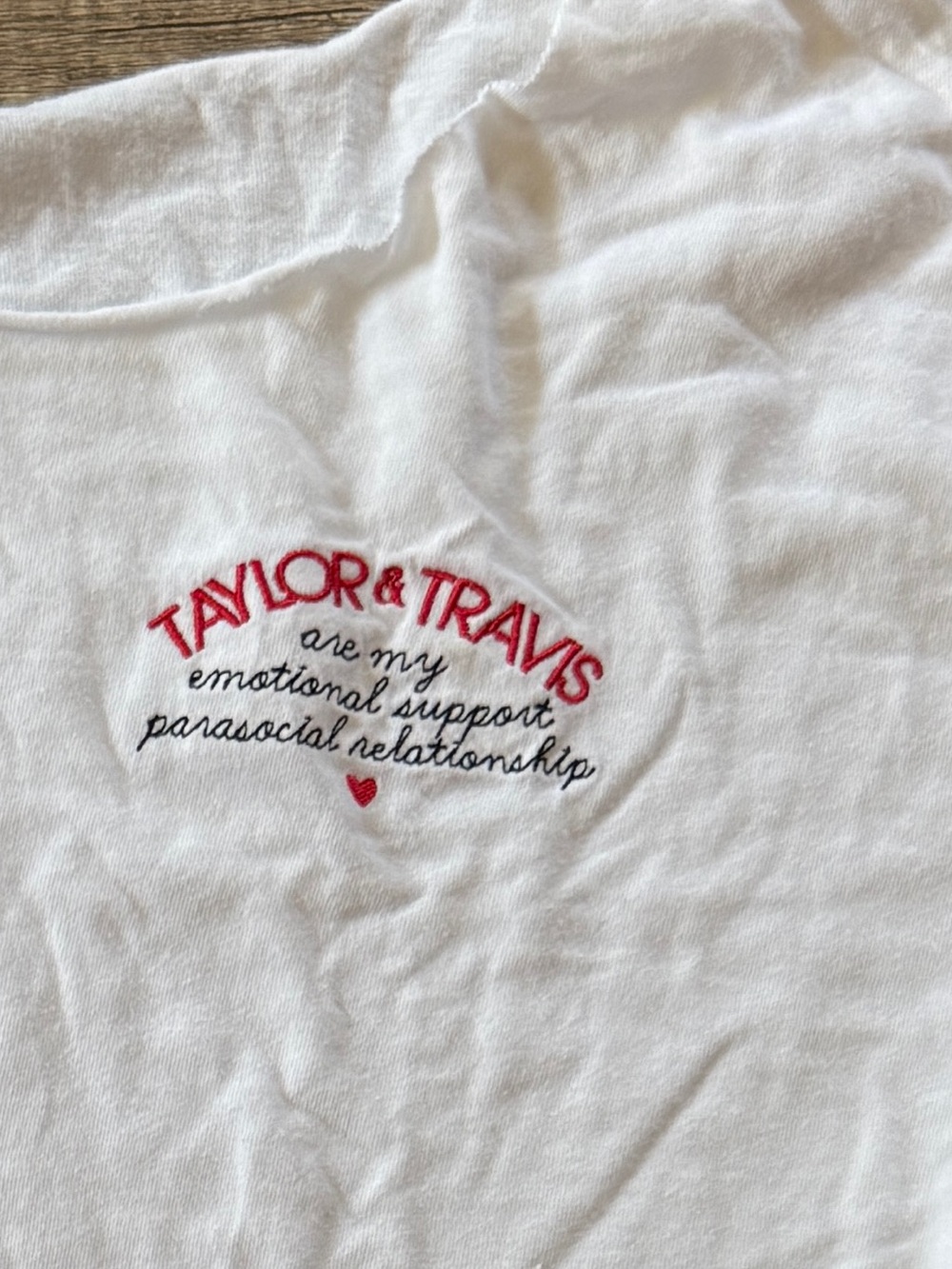 Funny Travis and Taylor embroidered tee- raw hem and cropped. Size large.